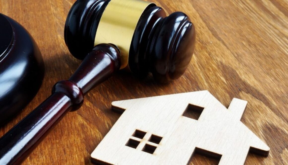 Real estate and property law. House model and gavel.